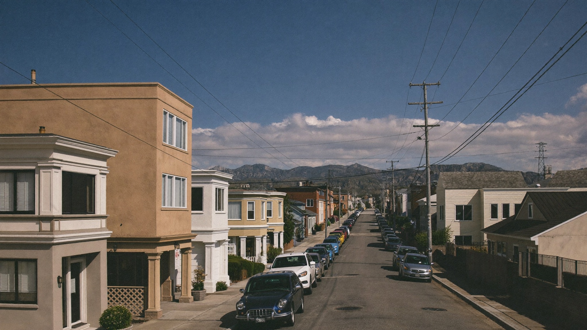 A residential Denver neighborhood with the Front Range in the distance